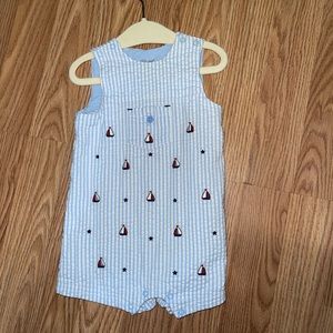 A 9 month old little me one piece sailer boy’s jumpsuit.
